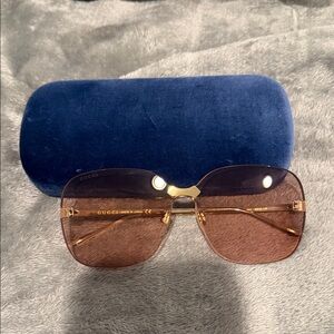 Gucci Women's Sunglasses with Gold Frame and Pink Lenses
